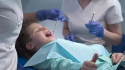 Dental examination of the oral cavity of the child