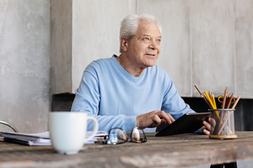 Good looking elderly man enjoying a productive morning