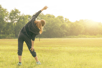 Office woman alone in jungle.Taking deep breath with open hands in yoga pose inhale fresh air ..