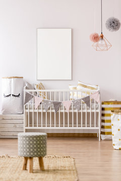 White Frame Mockup In Baby Nursery