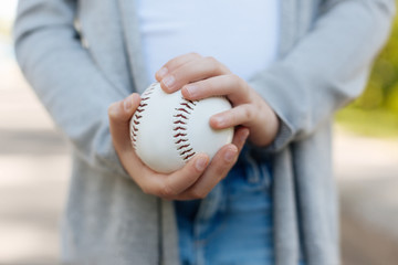 Close up of baseball ball that being in hands
