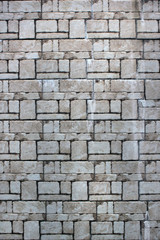 Dirty old white brick wall