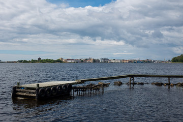 The archipelago bridge in the foreground does not reach the city as seen at the horizon