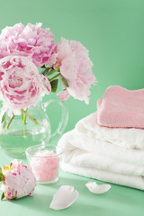 Obraz na płótnie Canvas bath and spa with peony flowers herbal salt towels