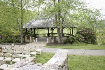 Obraz premium Wooden Gazebo Decorated for a Rustic Wedding Ceremony