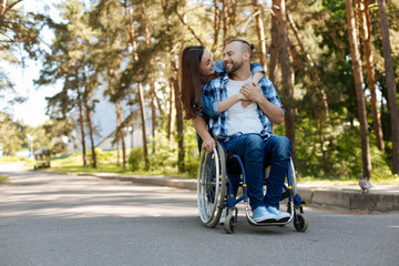 Smiling woman embracing her boyfriend