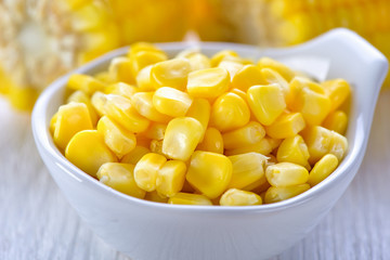 corn in a bowl on wood