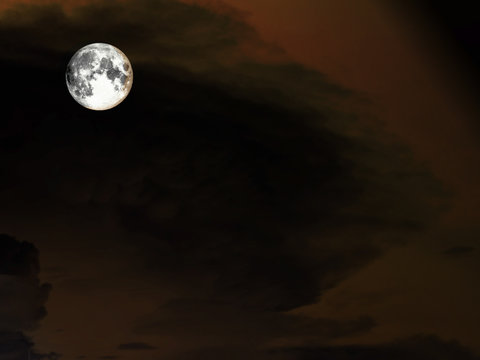 full moon and heap dark cloud in night sky