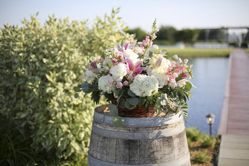 Fototapeta na wymiar Pink, White, and Green Wedding Ceremony Flower Arrangement Decor