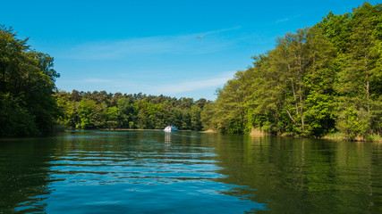 beautiful lake with trees and a boat