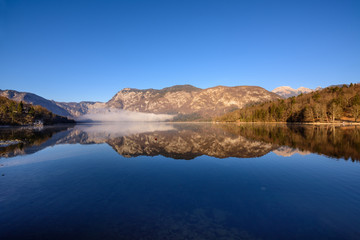 Naklejka na ściany i meble Mountains reflected in Lake Bohinj 