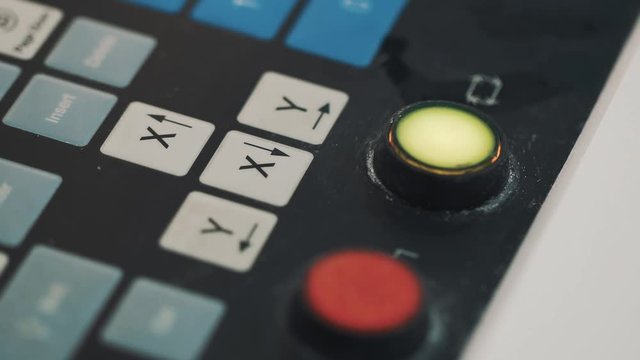 Finger push button on control panel keyboard until it flash up green at factory, close up