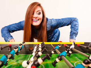 woman playing table football game