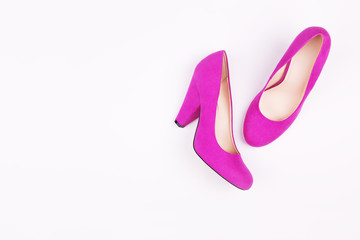 Purple female shoes on a white background. Concept idea. Flat lay, fashion trendy background.