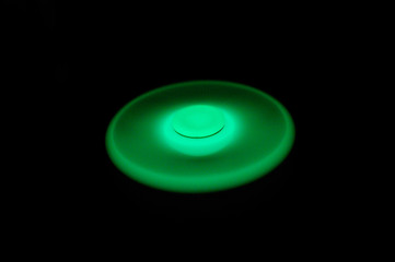 Glowing in the dark fidget spinner, rotating