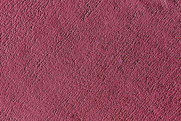 Fototapeta premium Pink color plaster wall surface.