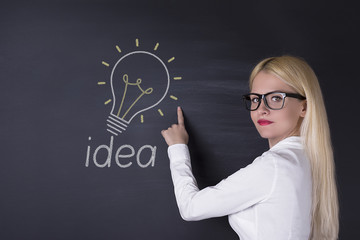 Business woman and big idea bulbs