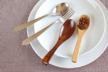 Fork and Spoon with empty white plate
