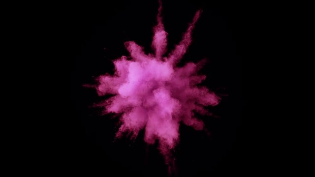Colorful powder/particles fly after being exploded against black background. Shot with high speed camera, phantom flex 4K. Slow Motion. Included 2 different color versions.