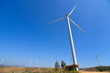 Wind Turbine for alternative energy on background sky.