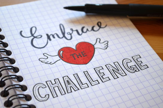 EMBRACE THE CHALLENGE hand lettered in notebook