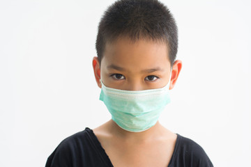 Asian boy with flu in facial mask isolated on white background