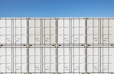 Colorful stack of container shipping at dockyard