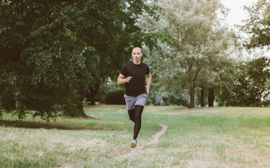 Man running jogging outdoors in nature