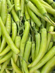Green pepper top view in the market.