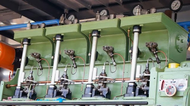 Marine diesel engine  /  An old, big marine diesel engine is working with all components moving
