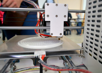 The process of working 3D printer and creating a three-dimensional object