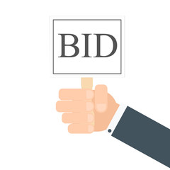 hand holding auction paddle