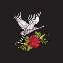 Embroidery flowers and crane on black background. Stock line vector illustration.