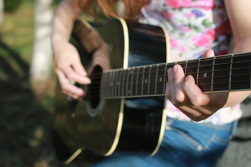 Fototapeta premium guitar string woman hand outdoor