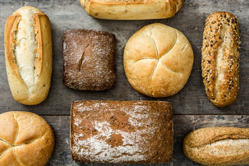 Mixed breads on wooden table.Top view
