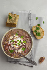 Slow cooker bean soup with mushrooms and garlicky bread.