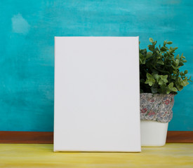 Poster template. White empty canvas in the modern interior. 