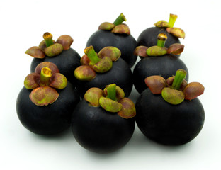 Mangosteen fruit isolated on white background. Mangosteens is a Popular fruits in thailand at summer season.