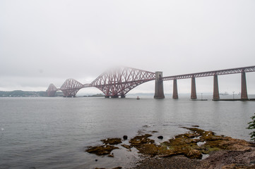 Forth Rail Bridge in the fog near the city of Edinburgh in Scotland