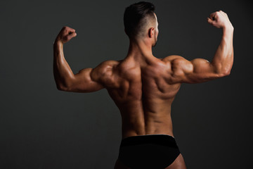 Fototapeta na wymiar biceps and triceps of athlete with muscular body