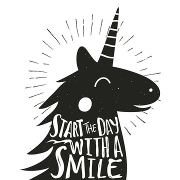 Vector hand drawn typography poster with smiley Unicorn. Start the day with a smile.