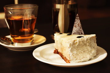 Cheesecake cake decorated with chocolate and tea