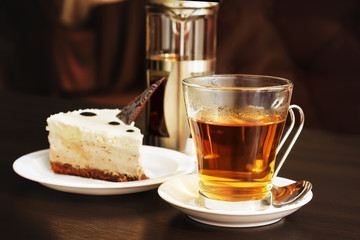 Cheesecake cake decorated with chocolate and tea