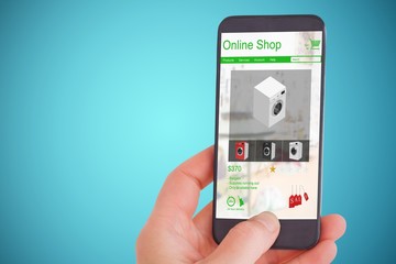 Composite image of female hand holding a smartphone