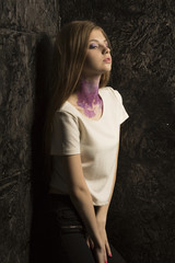 Portrait of young lovely model with bright makeup and glitter on her neck
