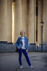 Tourist girl with a backpack