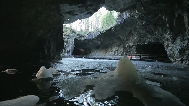 An icy stalagmite on the undeground lake in the big marble cave