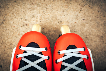 Roller skates orange color on asphalt