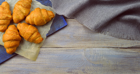 cozy and tasty breakfast.Croissants on a tray. Top view.