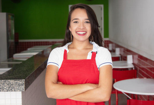 Laughing caucasian waitress in a fast food restaurant